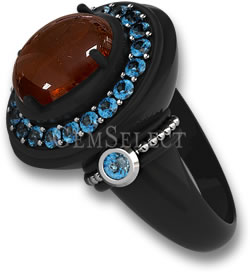 黑色金属戒指，配以锰铝榴石凸圆形主石和蓝色托帕石光环