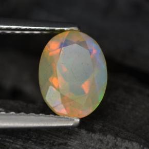 0.88克拉天然多色欧泊，椭圆形切割，8.1×6.1毫米，半透明