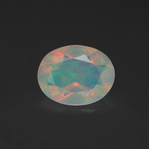 0.98克拉天然多色欧泊，椭圆形切割，9.1×7.1毫米，透明