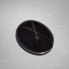 28.81克拉天然黑色星光石榴石，椭圆形切割，18.8×14.6毫米，不透明