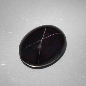 28.81克拉天然黑色星光石榴石，椭圆形切割，18.8×14.6毫米，不透明