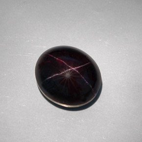 32.55克拉天然黑色星光石榴石，椭圆形切割，17×14.9毫米，不透明