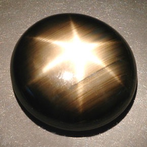 55.93克拉天然黑色星光蓝宝石，椭圆形切割，22.4×20.5毫米，不透明