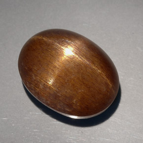 23.68克拉天然棕色星光日光石，椭圆形切割，18.8×14.3毫米，不透明