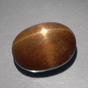 23.68克拉天然棕色星光日光石，椭圆形切割，18.8×14.3毫米，不透明