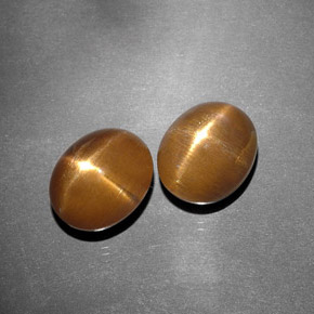 天然棕色星光日光石，椭圆形切割，11.2×9.1毫米，不透明