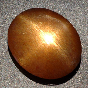 8.09克拉天然棕色星光日光石，椭圆形切割，16×13.2毫米，不透明