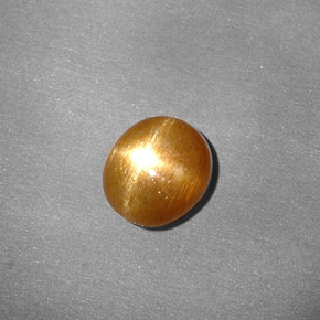 0.80克拉天然棕色星光日光石，椭圆形切割，6.7×6毫米，不透明