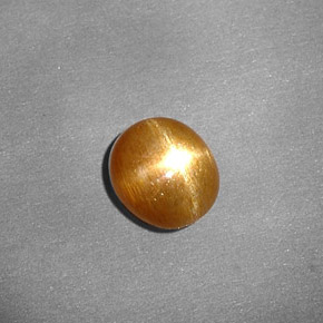 0.80克拉天然棕色星光日光石，椭圆形切割，6.7×6毫米，不透明