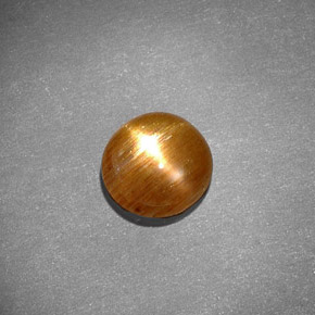 0.97克拉天然棕色星光日光石，椭圆形切割，7.4×7.2毫米，不透明