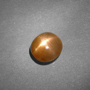 0.91克拉天然棕色星光日光石，椭圆形切割，6.4×6毫米，不透明
