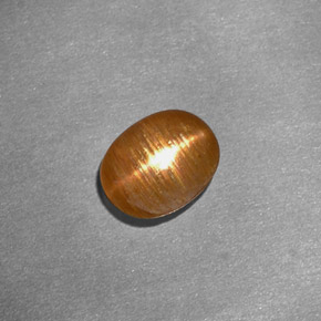 1.01克拉天然棕色星光日光石，椭圆形切割，7.5×6毫米，不透明