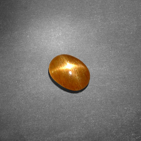 0.70克拉天然棕色星光日光石，椭圆形切割，7.4×5.4毫米，不透明