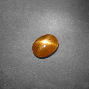 0.70克拉天然棕色星光日光石，椭圆形切割，7.4×5.4毫米，不透明