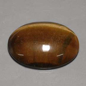 75.77克拉天然棕色Tiger's Eye，椭圆形切割，40×29.9毫米，不透明