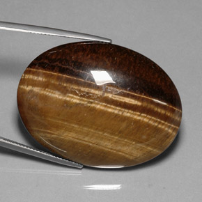 80.28克拉天然棕色Tiger's Eye，椭圆形切割，40×29.9毫米，不透明