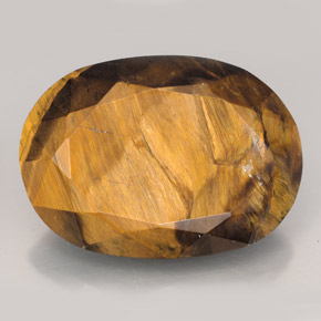 23.17克拉天然棕色Tiger's Eye，椭圆形切割，22.6×16.2毫米，不透明