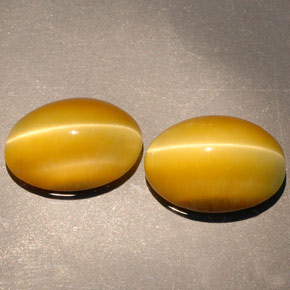 天然黄色Tiger's Eye，椭圆形切割，14×10.1毫米，不透明