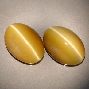 天然黄色Tiger's Eye，椭圆形切割，13.8×9.8毫米，不透明