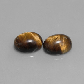 天然棕色Tiger's Eye，椭圆形切割，9×7.1毫米，不透明