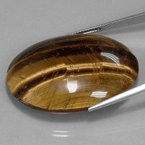 73.05克拉天然棕色Tiger's Eye，椭圆形切割，39.8×24.1毫米，不透明