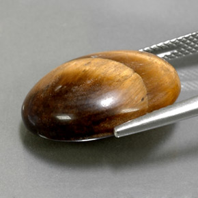 12.39克拉天然虎眼石，椭圆形切割，不透明