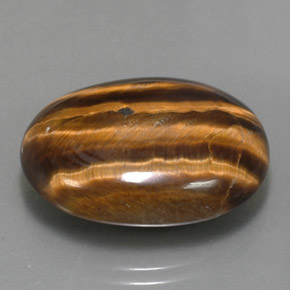 25.04克拉天然棕色Tiger's Eye，椭圆形切割，23.9×18毫米，不透明