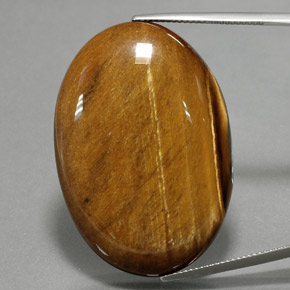 68.47克拉天然棕色Tiger's Eye，椭圆形切割，39.2×27.1毫米，不透明