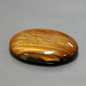 68.47克拉天然棕色Tiger's Eye，椭圆形切割，39.2×27.1毫米，不透明