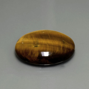 22.43克拉天然棕色Tiger's Eye，椭圆形切割，25.2×20.3毫米，不透明