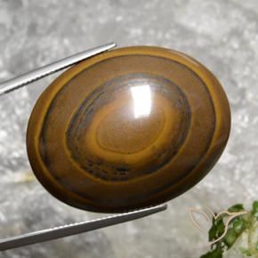 89.36克拉天然棕色Tiger's Eye，椭圆形切割，34.7×27.1毫米，不透明