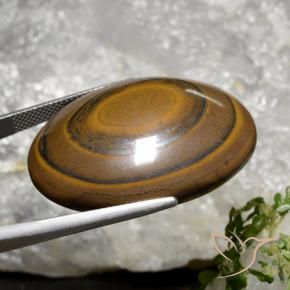 89.36克拉天然棕色Tiger's Eye，椭圆形切割，34.7×27.1毫米，不透明