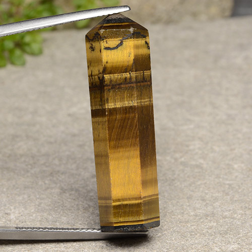 24.72克拉天然棕色Tiger's Eye，异形，33.1×9.5毫米，不透明