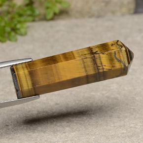 24.72克拉天然棕色Tiger's Eye，异形，33.1×9.5毫米，不透明